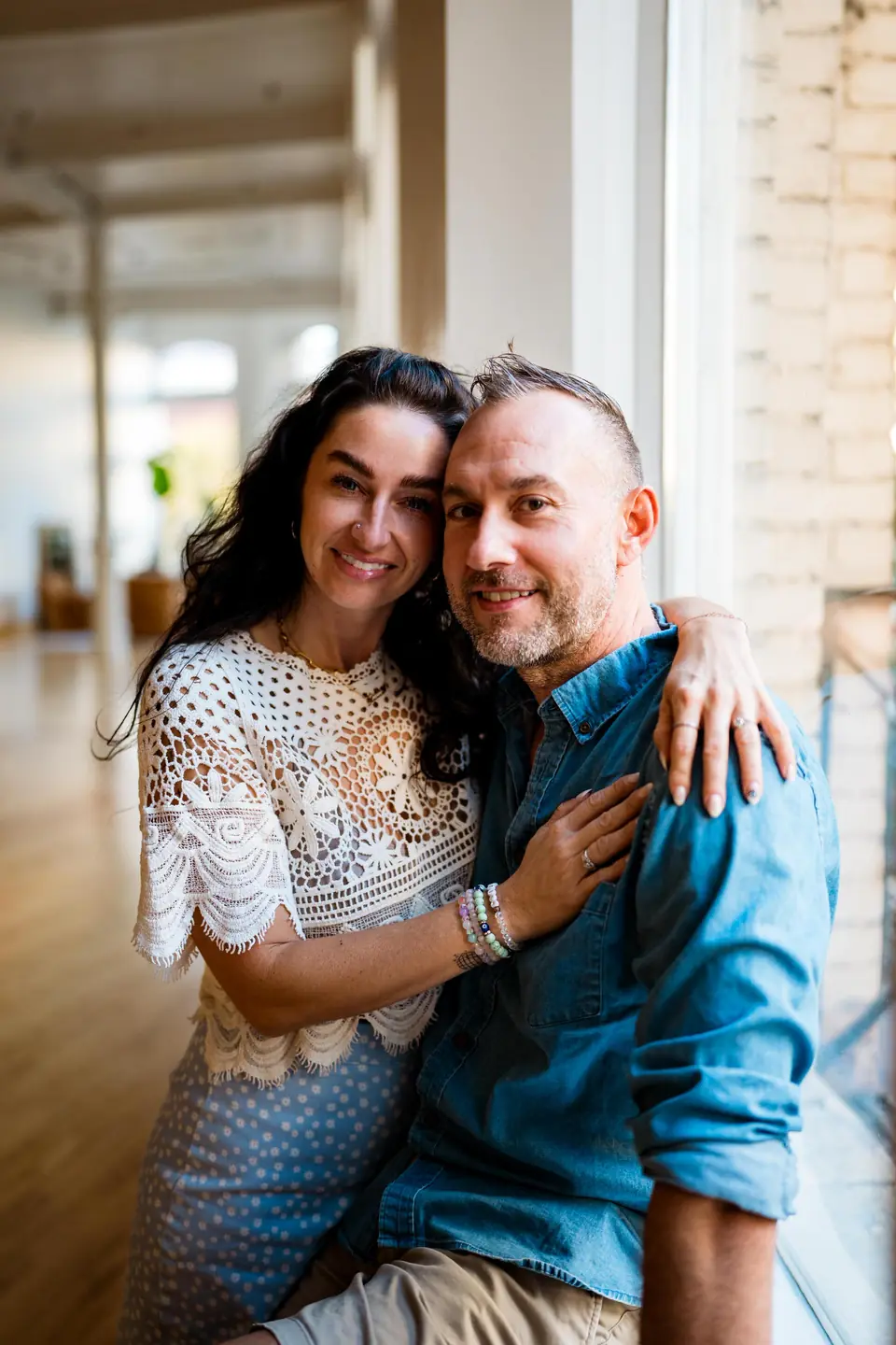 Couple embracing at their anniversary celebration