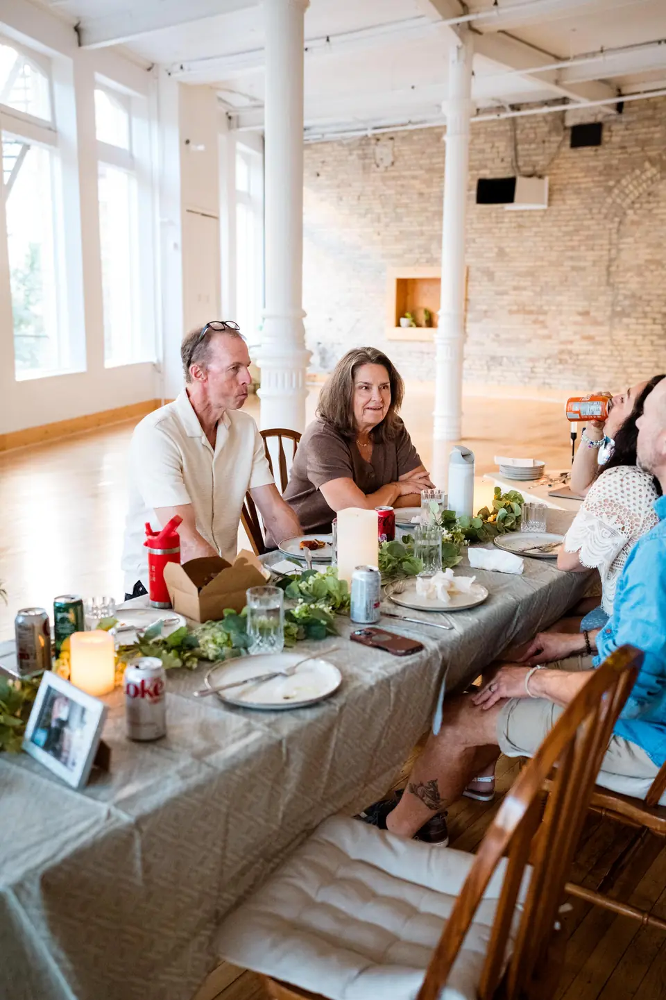 Family gathered at a long dinner table for an anniversary