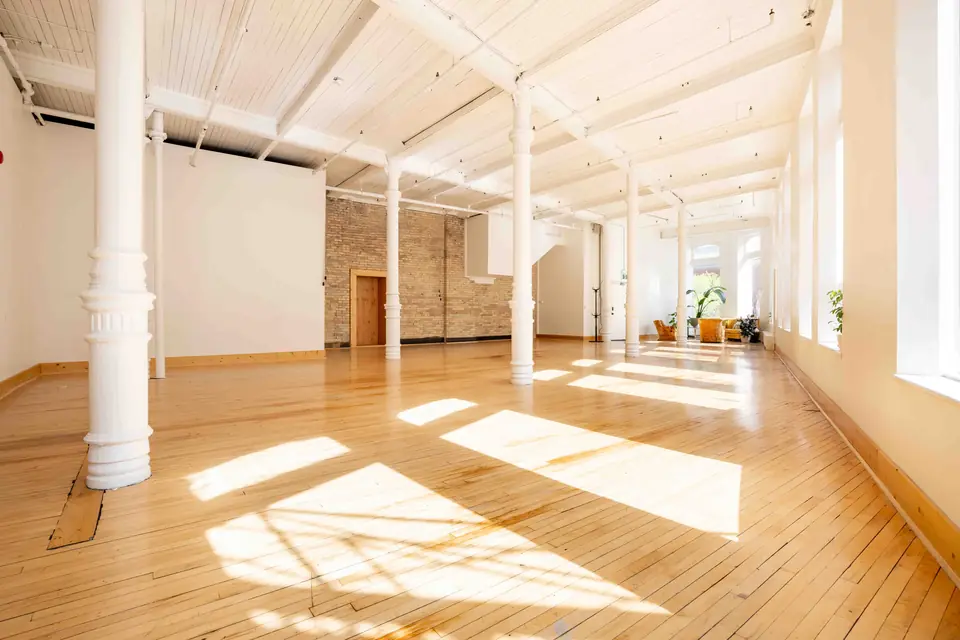 Morning sun pouring through the east-facing windows across the main hall