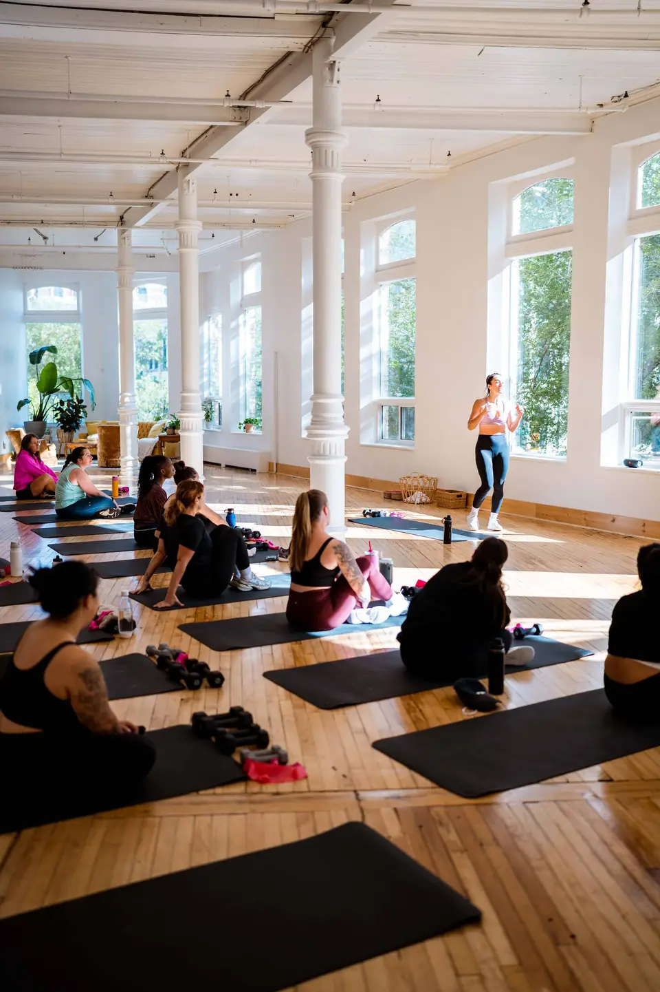 Group fitness class spread across the main hall