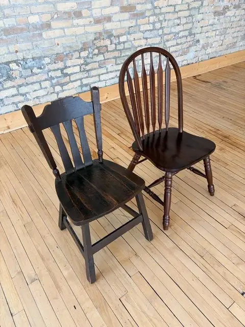 Two wooden dining chairs at The Harlow Exchange