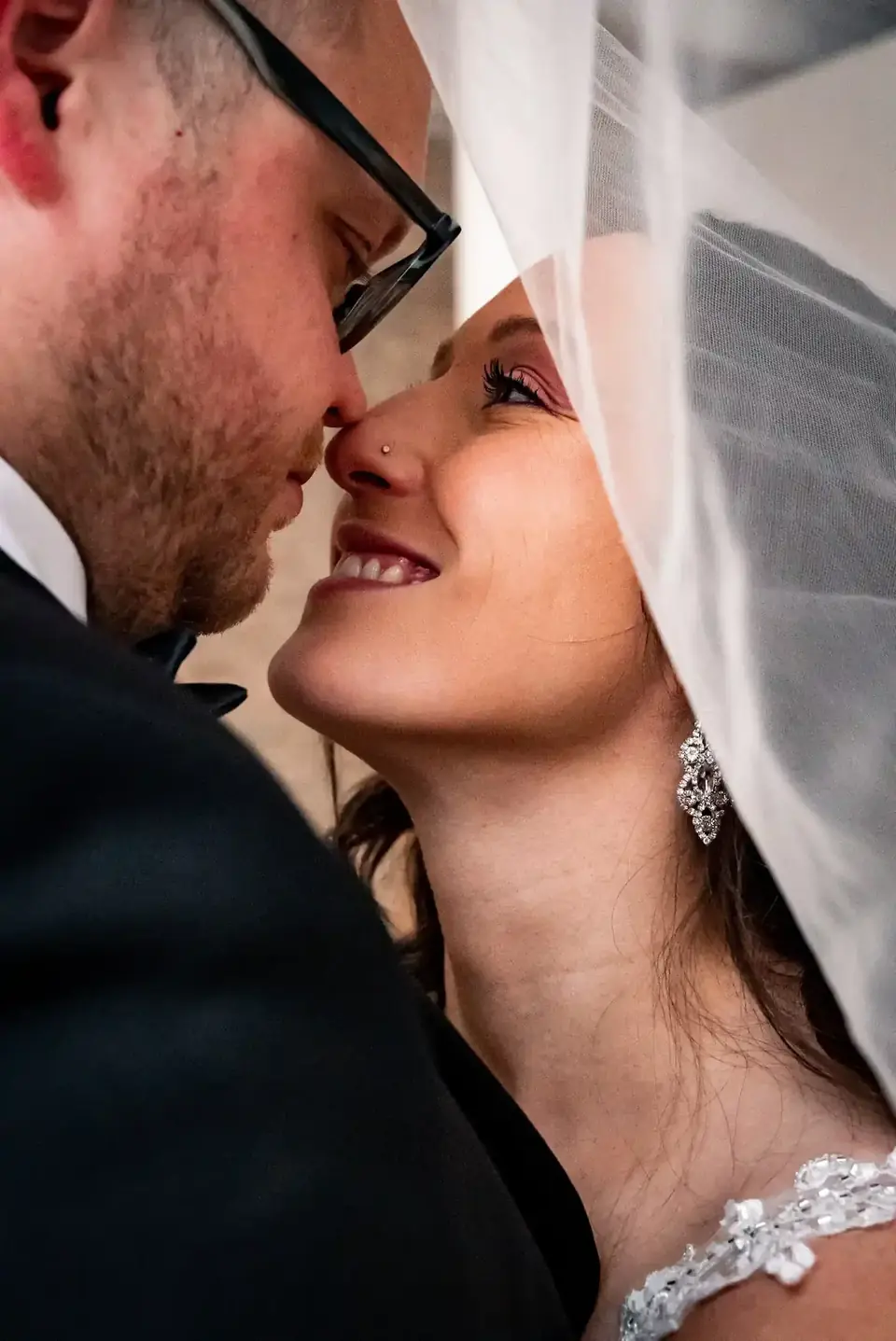 Close portrait of a couple under a veil at The Harlow Exchange