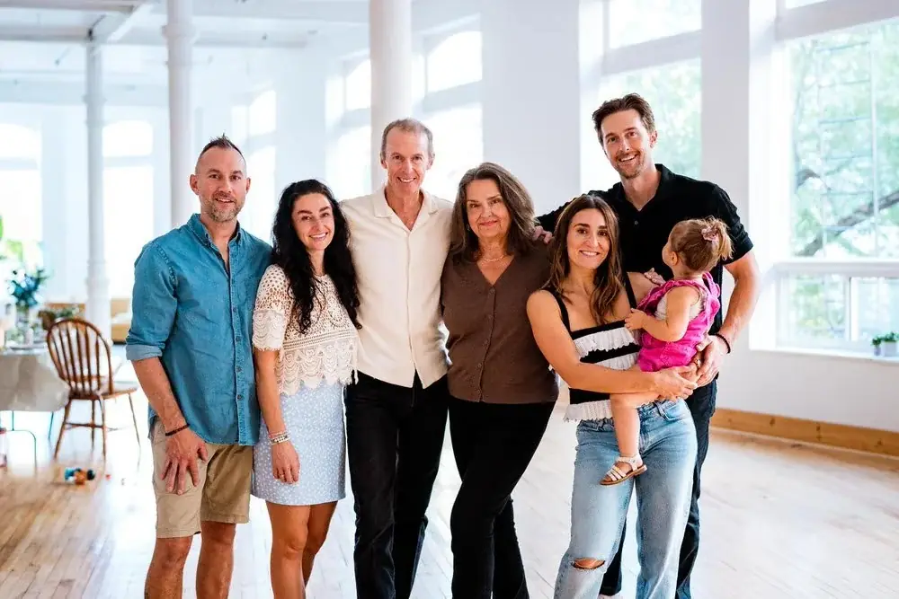 Family group smiling together in the bright main hall